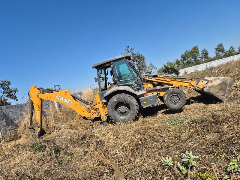 CASE TLB - slope excavation, Zambia CASE TLB excavating a slope in Zambia