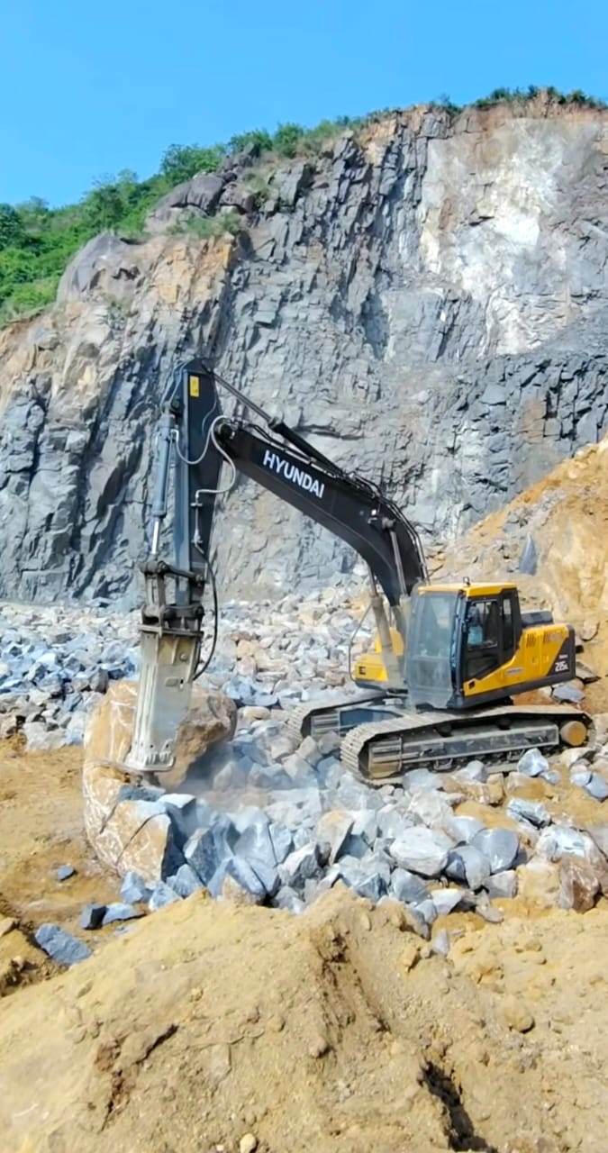 Hyundai breaker - quarry, Zambia Hyundai excavator with breaker attachment in a quarry in Zambia