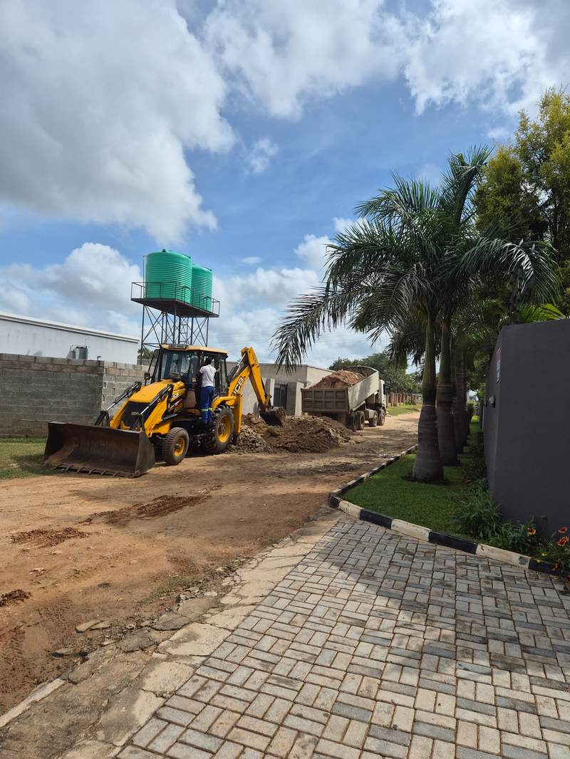 JCB TLB - property site, Zambia JCB TLB working at a property site in Zambia
